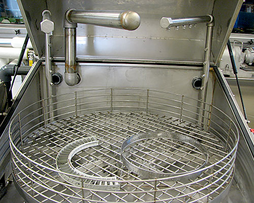 Niagara Systems parts washer with items in basket.
